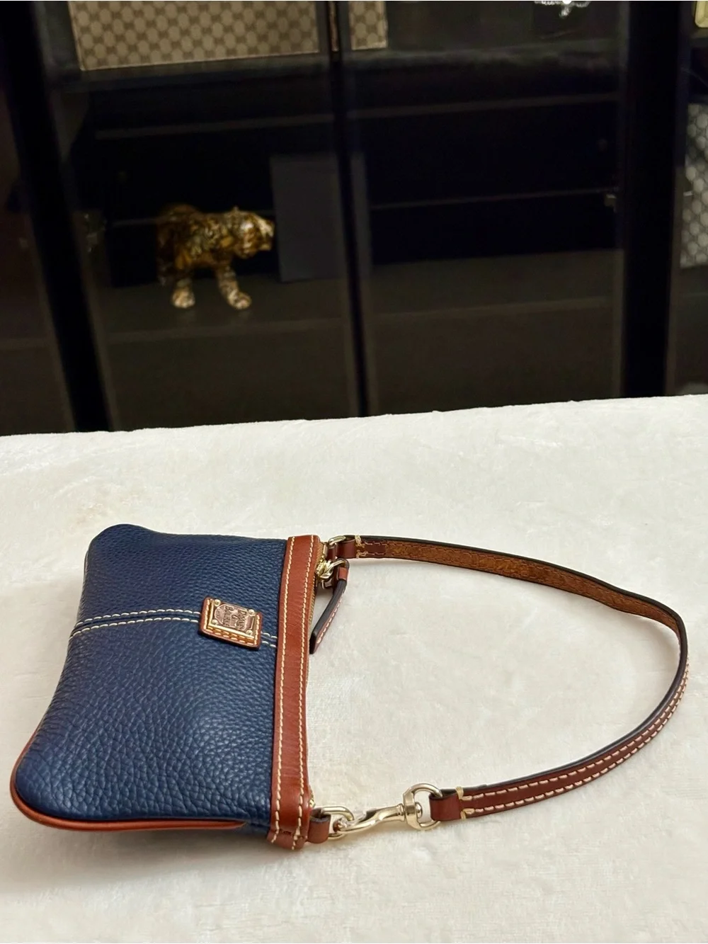 Dooney & Bourke Large Slim Cell Phone Wristlet – Navy Blue Pebble Grain Leather.